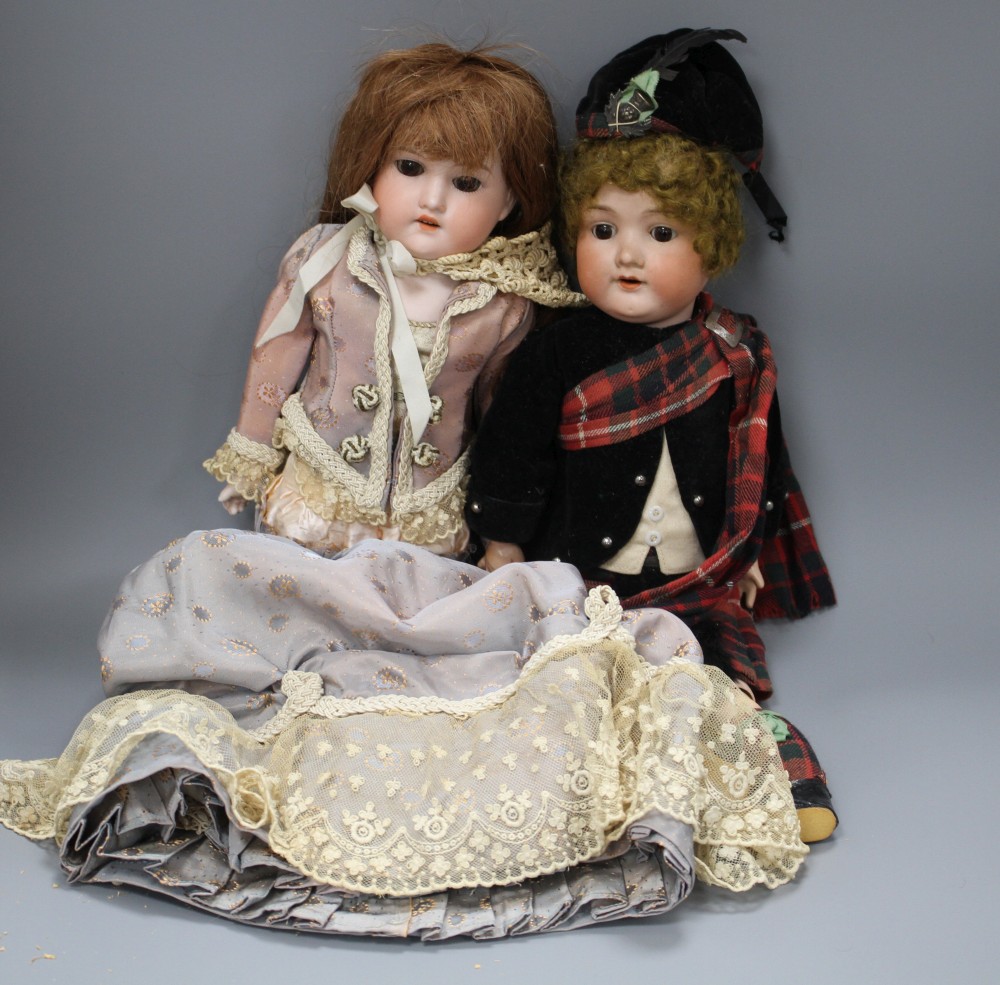 Two Armand Marseilles bisque head dolls, Floradora AOM, overall length 49cm and a child doll in Scots dress 390A2M, 44cm